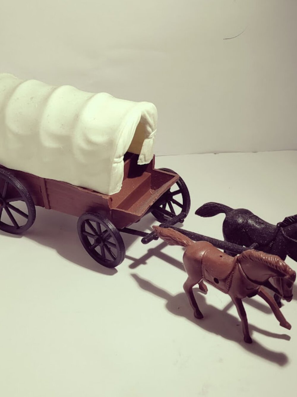 Small Plastic Covered Wagon Horse Toy